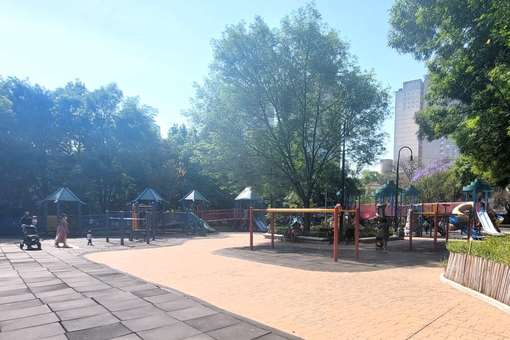 Family with a stroller at a playground in Mexico City