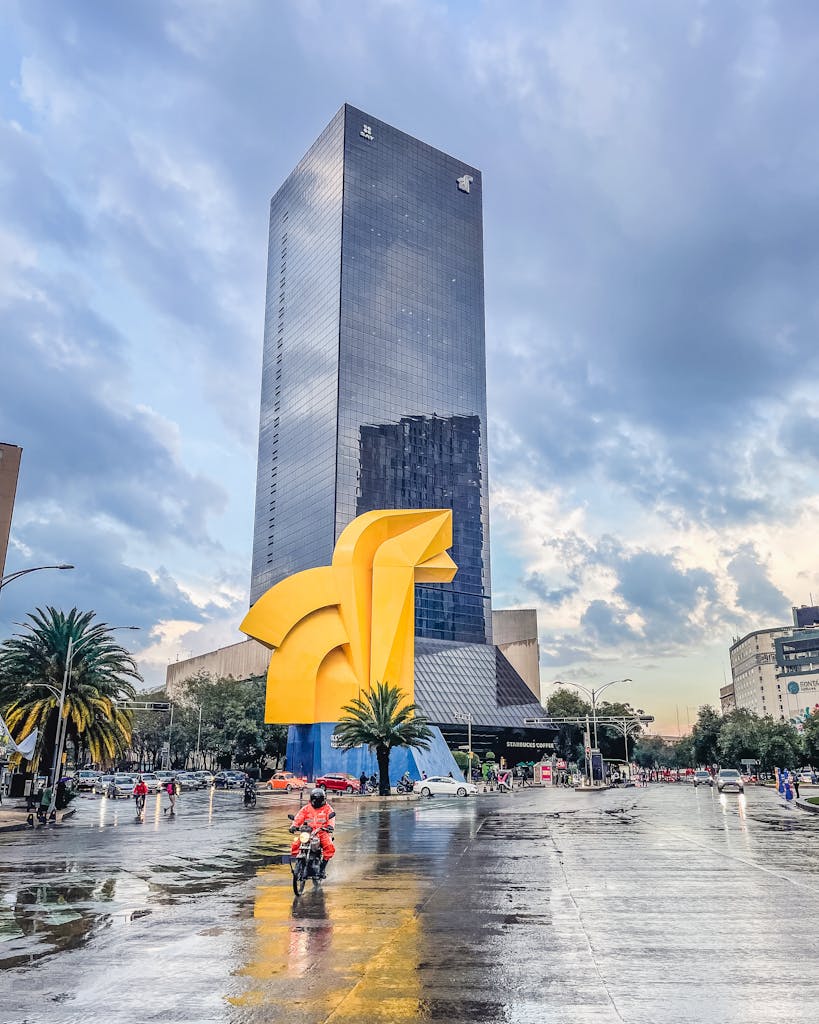 View of Torre del Caballito in Mexico City with reflections on a rainy day.
